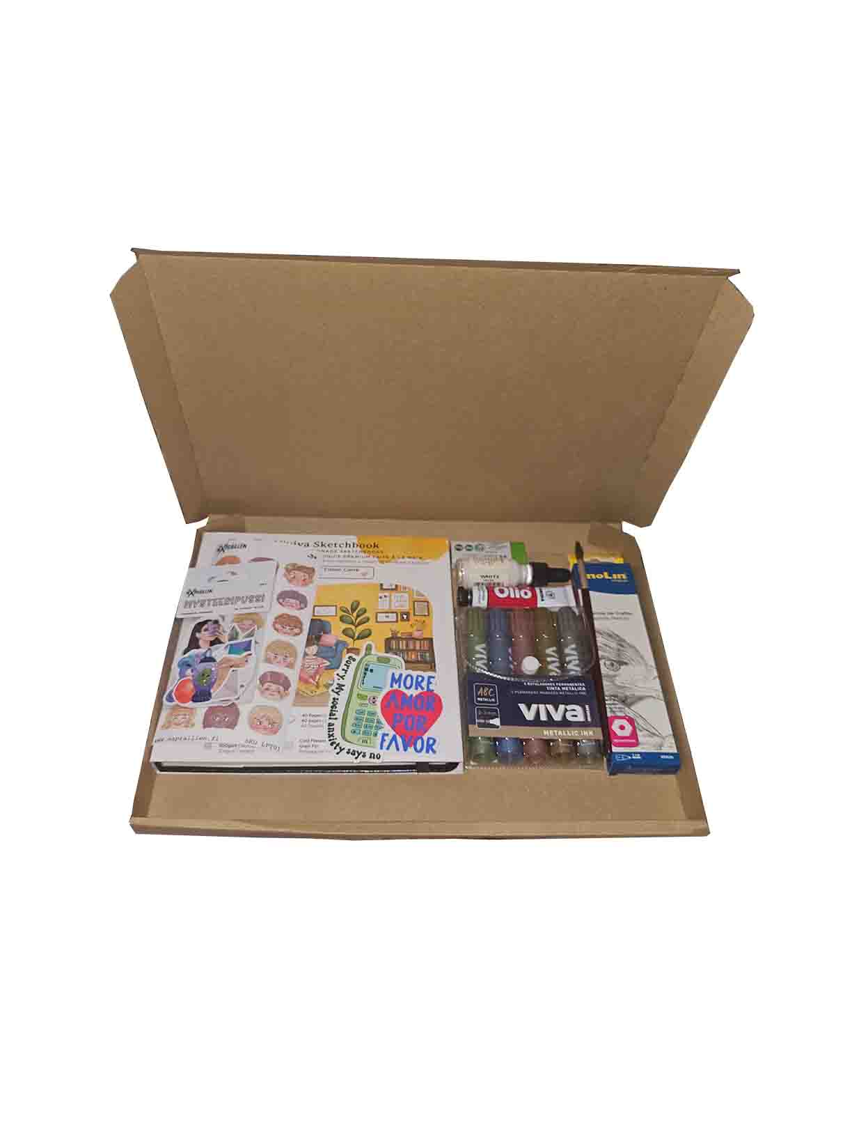Mysteeriboxi - Askartelutarvikkeet. Boxissa on tusseja, maalauslehtiöitä, kyniä, siveltimiä ja tarroja